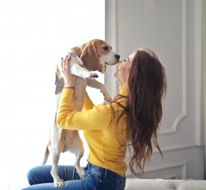 Lady holding a beagle